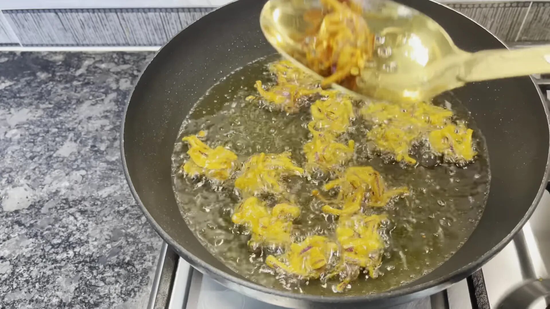 Serving the crispy onion pakoras