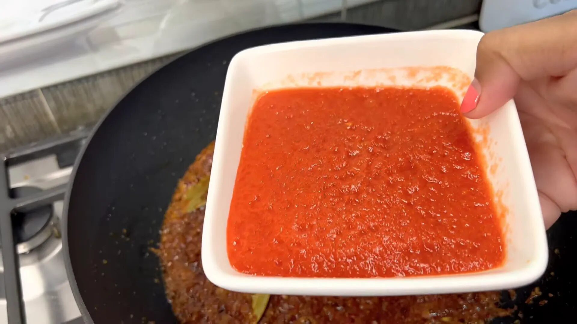 Mixing spices into the tomato onion mixture