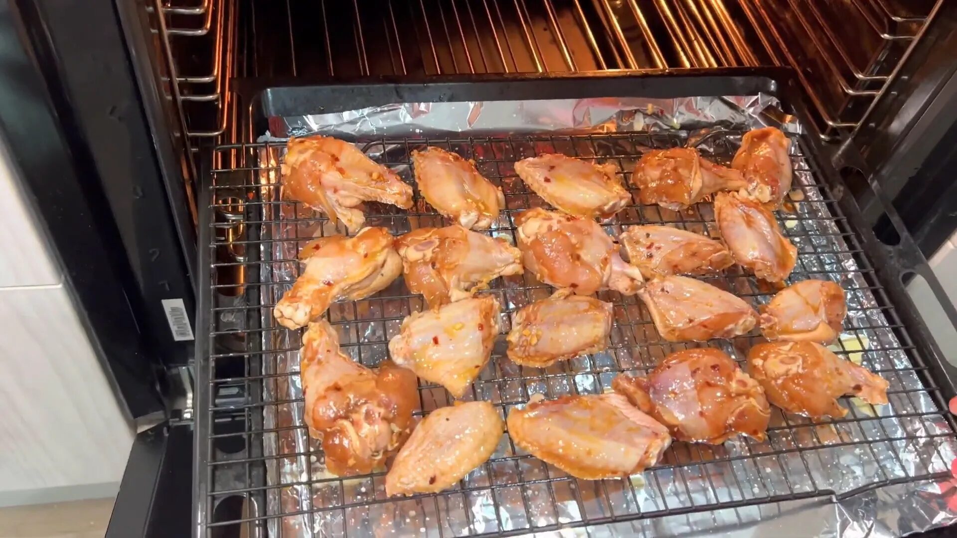 Flipping chicken wings in the oven