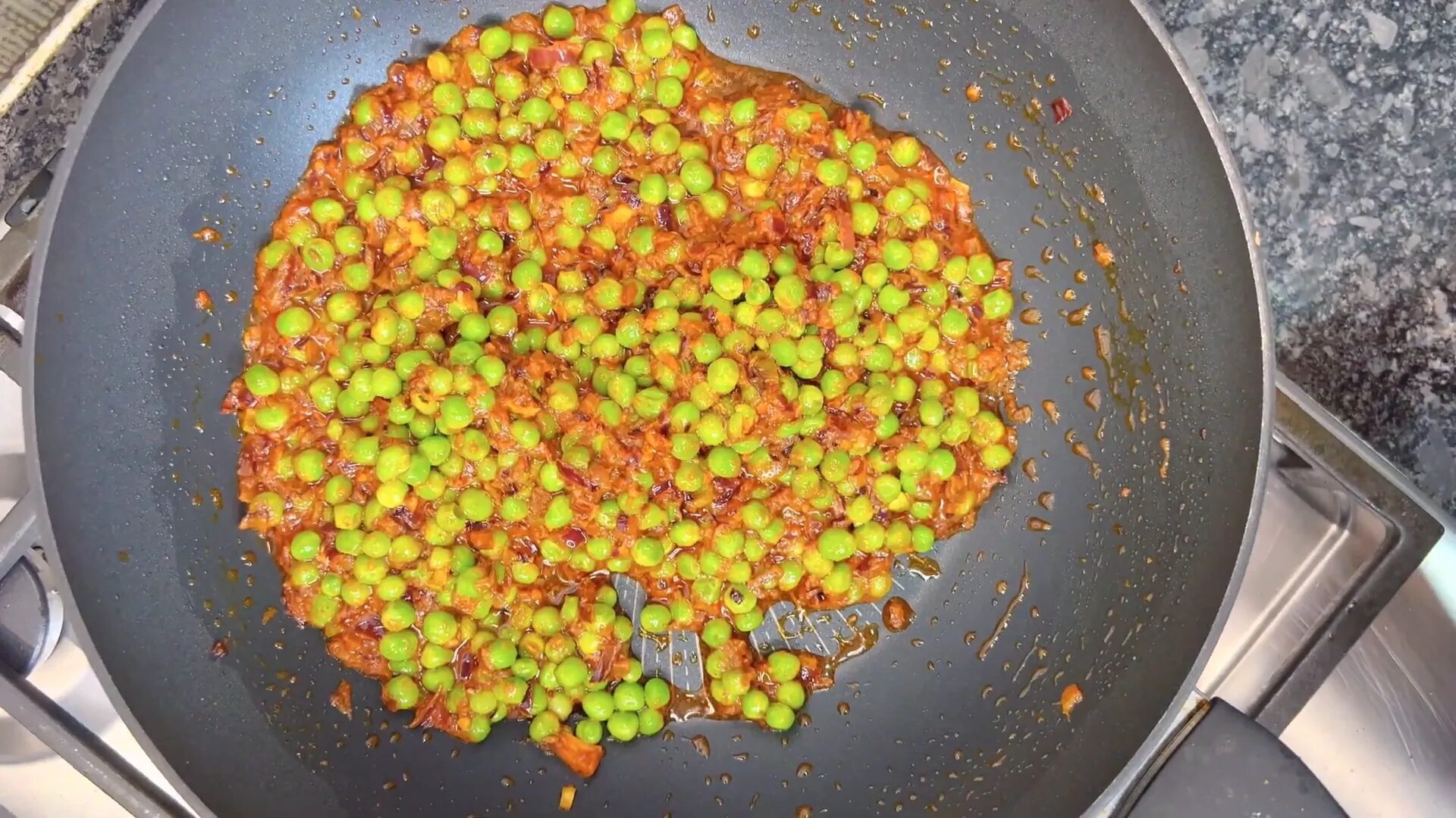 Adding peas and kasuri methi