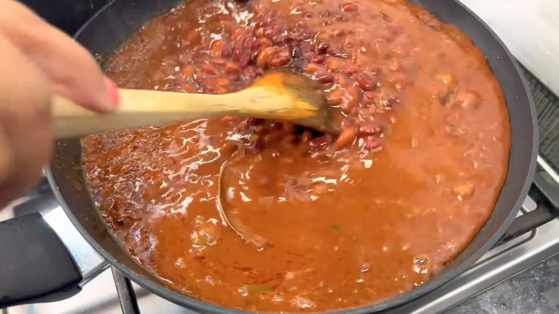 Garnishing rajma with cilantro