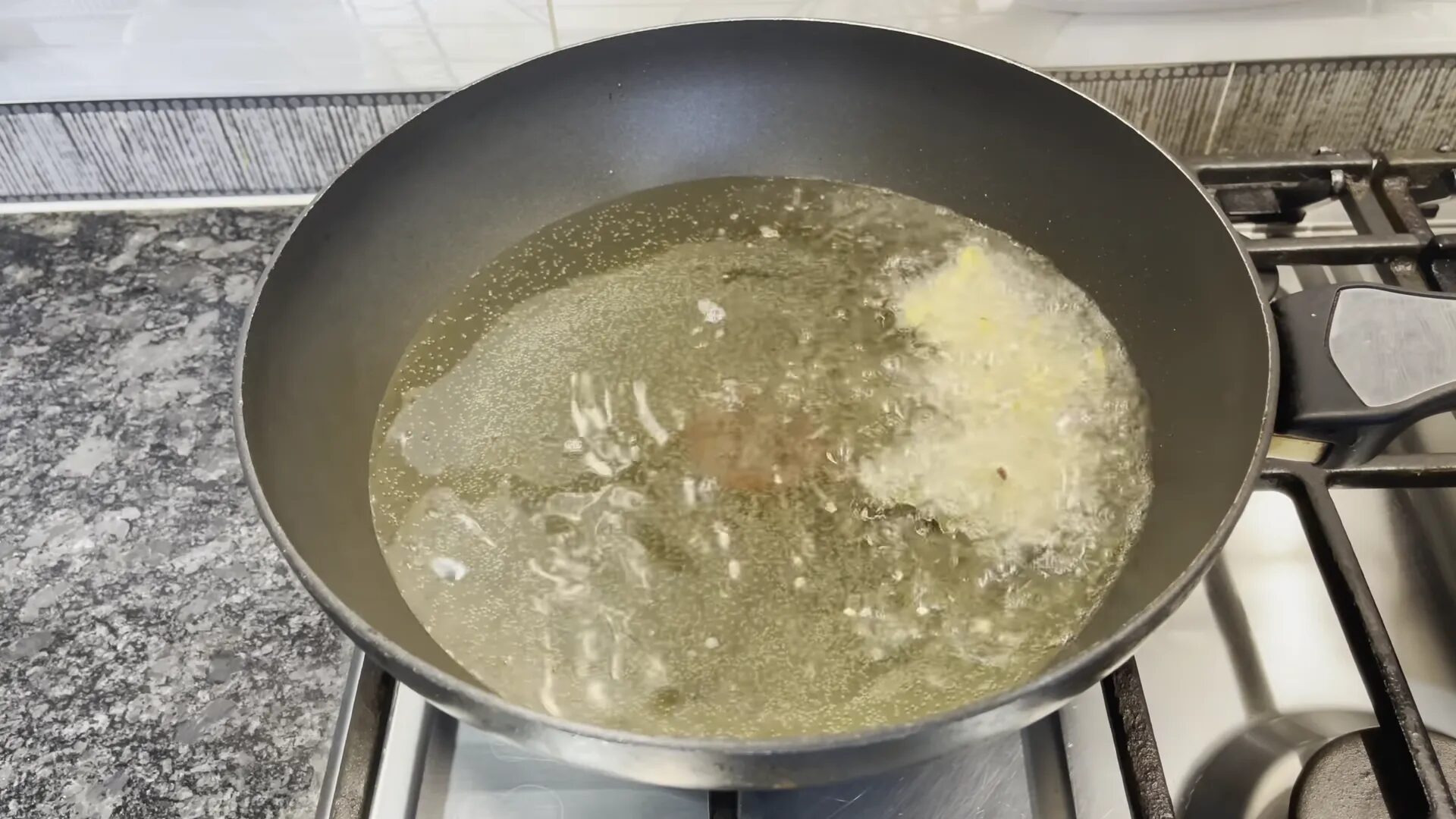 Frying the pakoras in hot oil